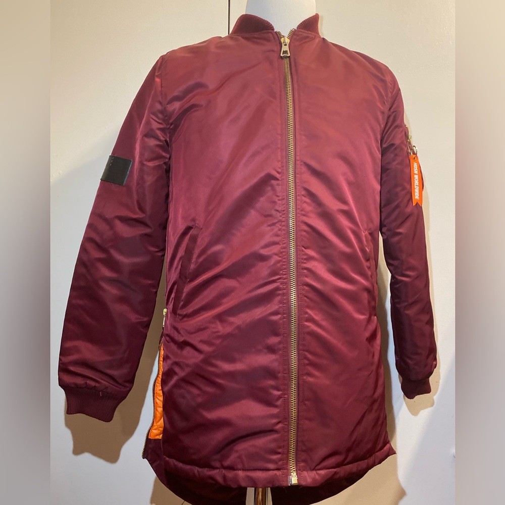 Hudson outerwear- men’s jacket with side Waite zipper, patch of us flag.